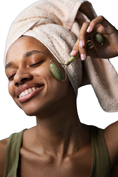 Beautiful woman with jade facial tools enjoying a relaxing beauty treatment